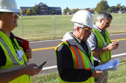 image of SAVE inspectors recorded building assessments using their phones, GPS units and paper forms.