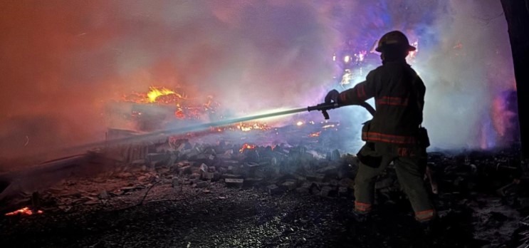 firefighter using water