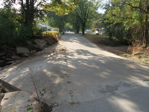 Visual description of a low water crossing before mitigation