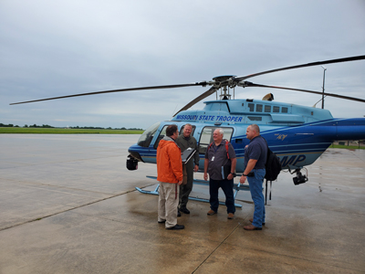 A joint Preliminary Damage Assessment team discussing impacted areas that will be surveyed for damage by utilizing a helicopter for homes that are the most inaccessible on June 12, 2019